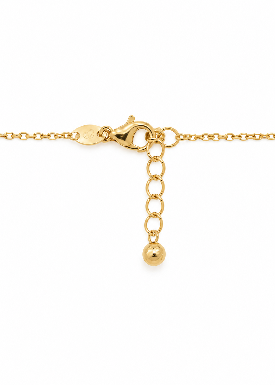 Lobster clasp and extension chain with a gold bead charm on the Italian 18K gold Station Necklace.