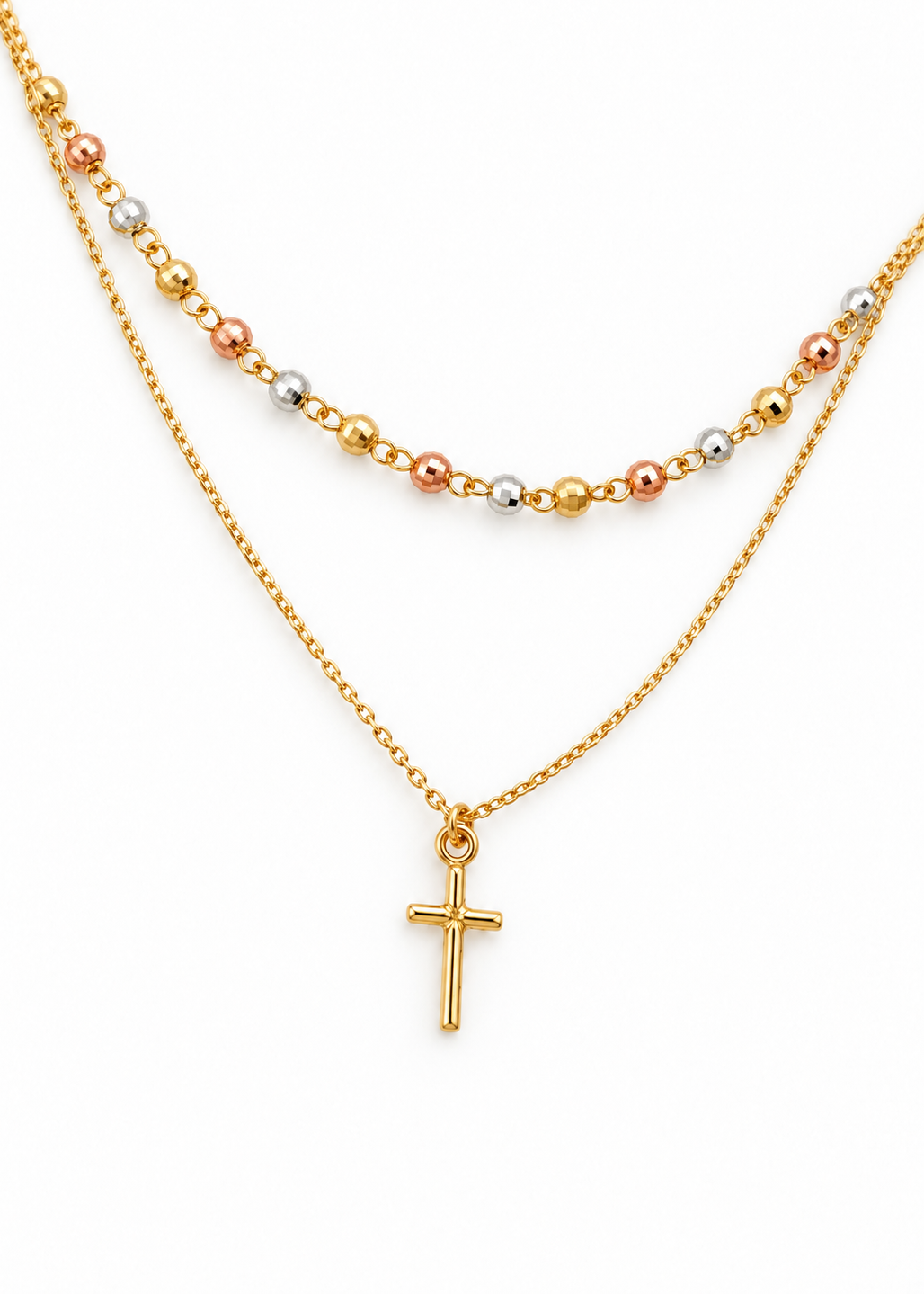 Close-up of the faceted yellow, white and rose gold beads and polished cross pendant.
